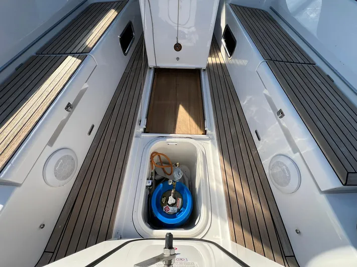 Xaca Yacht Photos Pics 2015 X-Yachts Xp 55 yacht deck with storage compartment and wooden flooring.