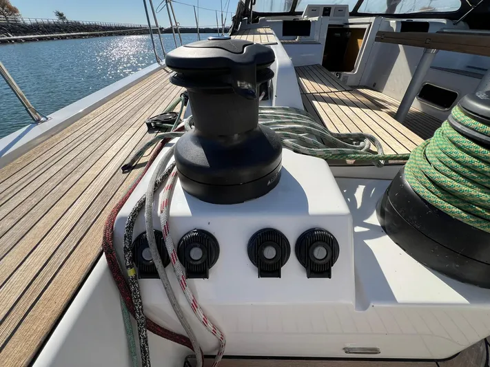 Xaca Yacht Photos Pics 2015 X-Yachts Xp 55 sailboat deck with winches and ropes, docked by the water.