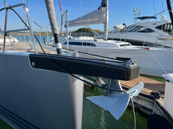 Xaca Yacht Photos Pics Xp 55 yacht bow with anchor, docked in marina, clear blue sky.