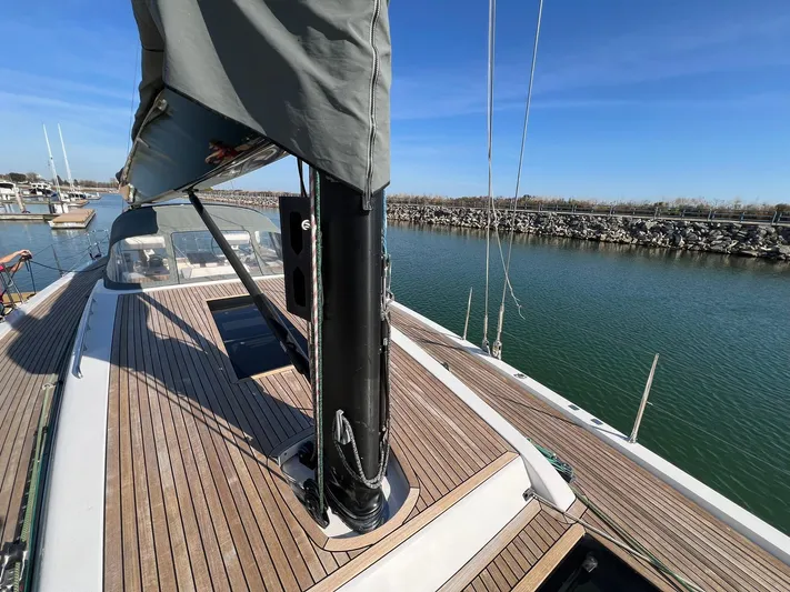 Xaca Yacht Photos Pics 2015 X-Yachts Xp 55 sailboat with teak deck, docked in a marina.