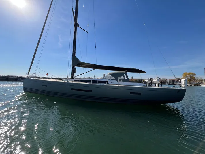 Xaca Yacht Photos Pics 2015 X-Yachts Xp 55 sailboat on calm water under clear blue sky.
