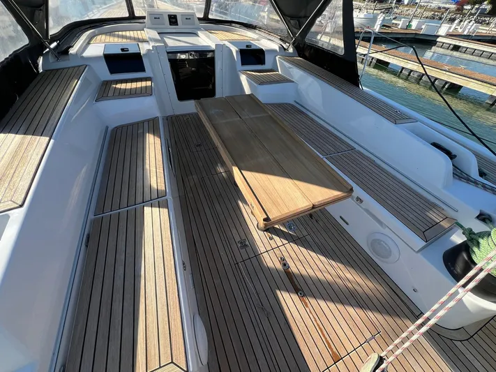 Xaca Yacht Photos Pics Spacious cockpit of 2015 X-Yachts Xp 55 with wooden seating and table.