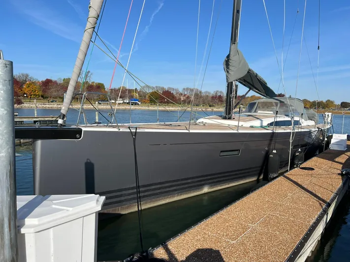 Xaca Yacht Photos Pics 2015 X-Yachts Xp 55 sailboat docked, sleek design, calm waters, clear sky.