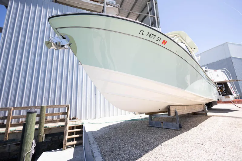  Yacht Photos Pics 2021 Grady-White Freedom 275 boat on dry dock, side view.