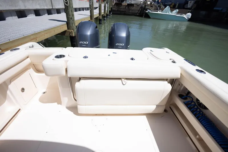  Yacht Photos Pics 2021 Grady-White Freedom 275 boat with dual 200 horsepower engines docked in marina.