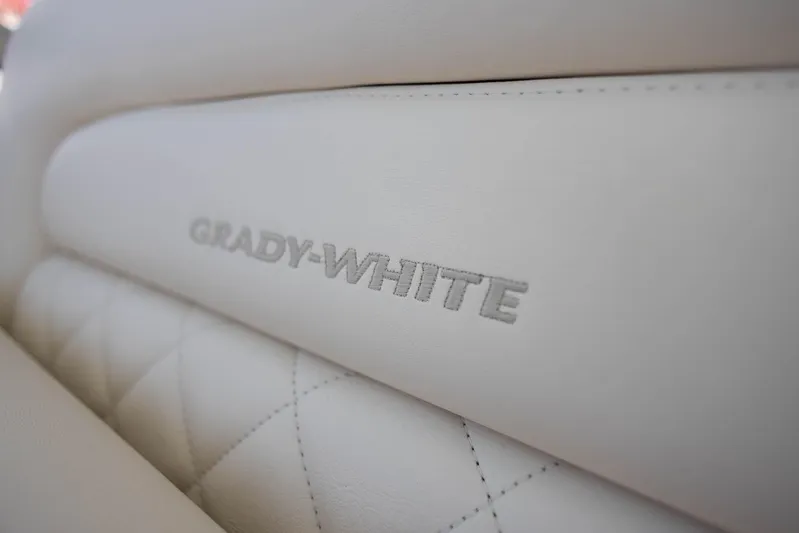  Yacht Photos Pics Grady-White Freedom 275 2021 boat seat with embroidered logo, featuring white leather upholstery.