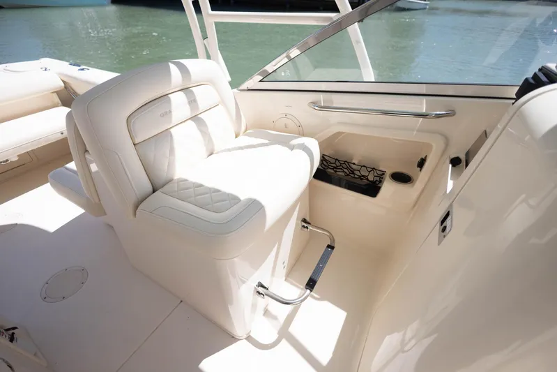  Yacht Photos Pics 2021 Grady-White Freedom 275 boat interior with white seating and water view.