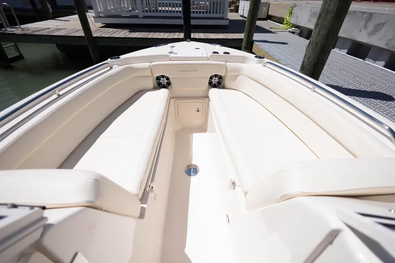  Yacht Photos Pics 2021 Grady-White Freedom 275 boat interior with spacious seating and sleek design.