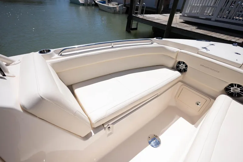  Yacht Photos Pics 2021 Grady-White Freedom 275 boat interior with cushioned seating and cup holders.