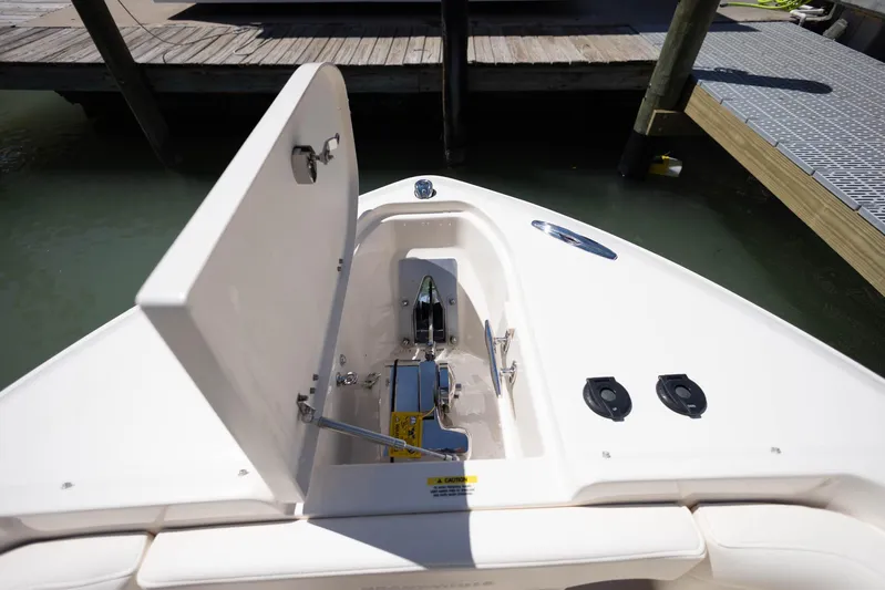  Yacht Photos Pics 2021 Grady-White Freedom 275 boat anchor compartment open at dock.