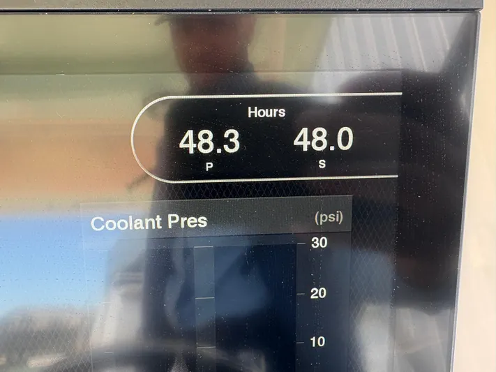  Yacht Photos Pics Display panel showing engine hours and coolant pressure on 2021 Grady-White Freedom 275 boat.