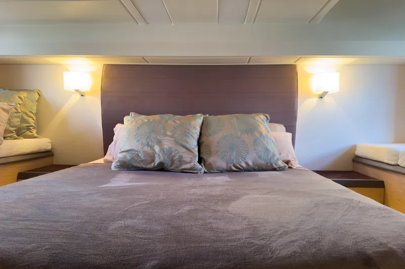  Yacht Photos Pics Luxurious bedroom interior of 2018 Beneteau Monte Carlo 5 yacht with elegant bedding.