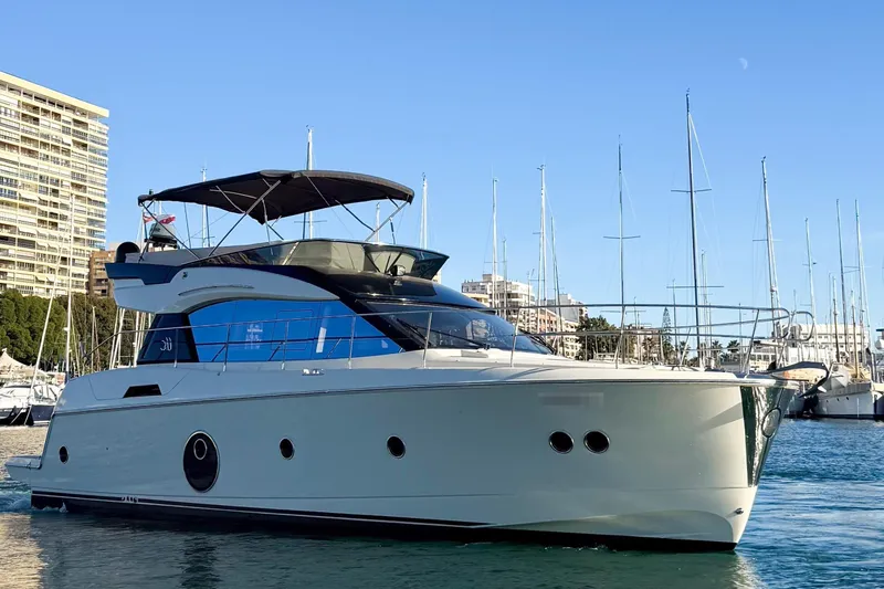  Yacht Photos Pics 2018 Beneteau Monte Carlo 5 yacht in harbor, blue sky.