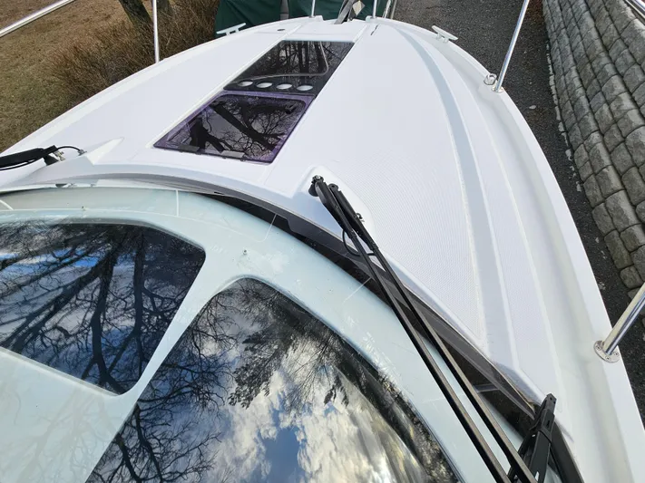  Yacht Photos Pics 2020 Beneteau Antares 9 boat deck with sleek design and windshield wipers.