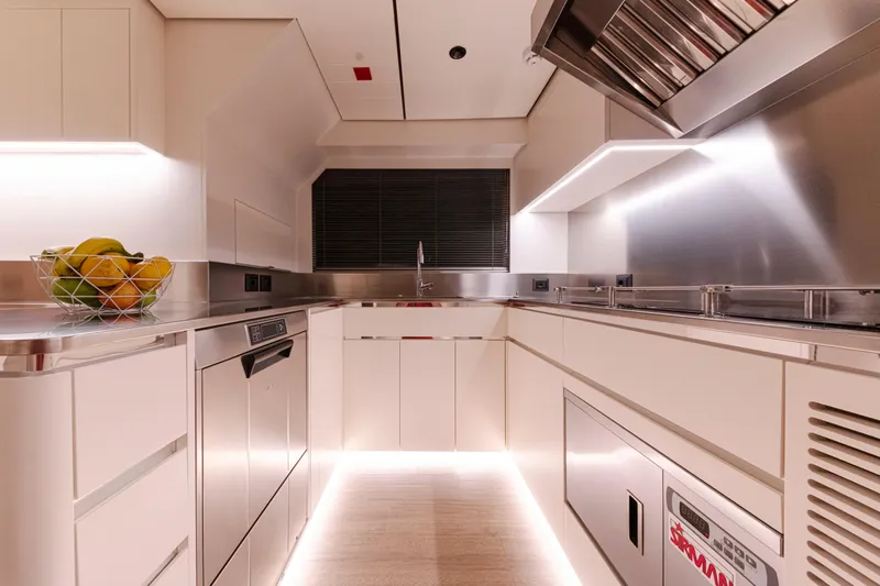 Ducale 120 Yacht Photos Pics Modern kitchen interior in Ocean King Ducale 120 yacht, 2027 model, featuring sleek design and ambient lighting.