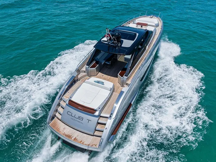 Club T Yacht Photos Pics 2023 Riva 68 Diable luxury yacht cruising on turquoise waters.