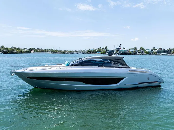 Club T Yacht Photos Pics 2023 Riva 68 Diable luxury yacht on calm water, side view.