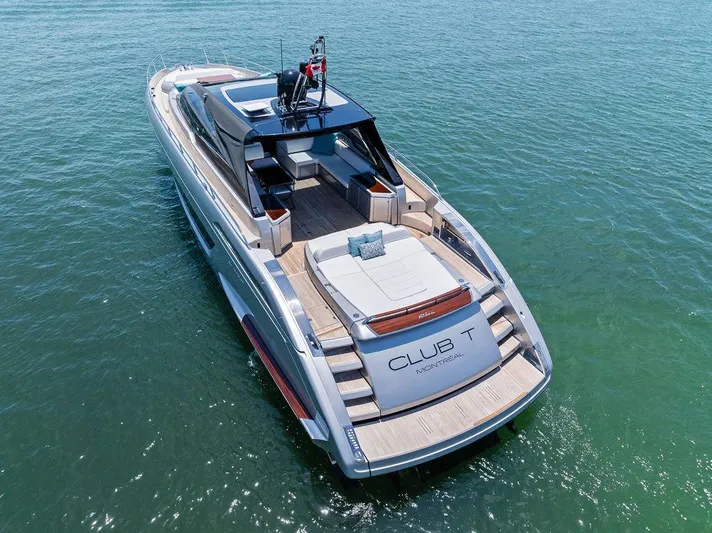 Club T Yacht Photos Pics 2023 Riva 68 Diable luxury yacht on calm water, rear view.