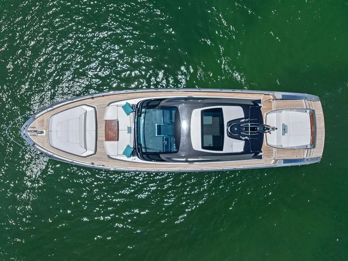 Club T Yacht Photos Pics Aerial view of 2023 Riva 68 Diable yacht on green water.