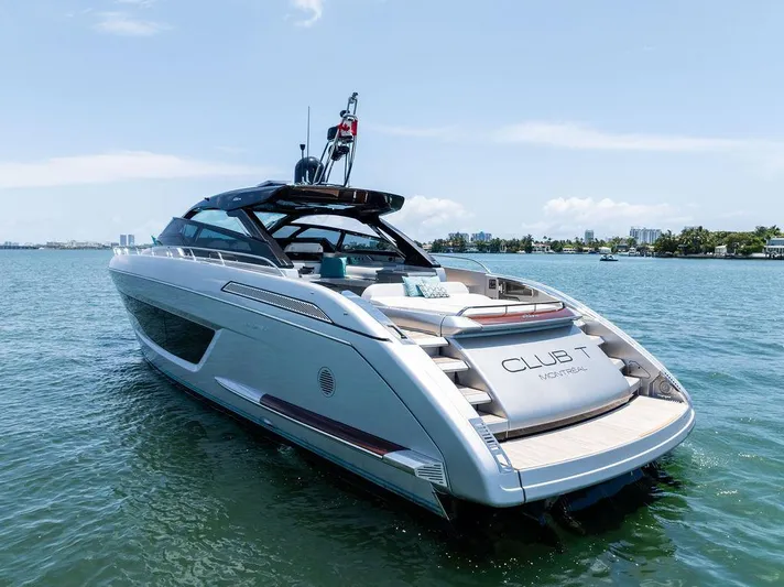 Club T Yacht Photos Pics 2023 Riva 68 Diable luxury yacht on calm water, showcasing sleek design and modern features.