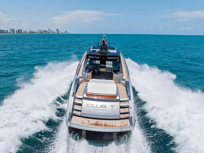 Club T Yacht Photos Pics 2023 Riva 68 Diable yacht cruising on open sea, leaving a wake behind.