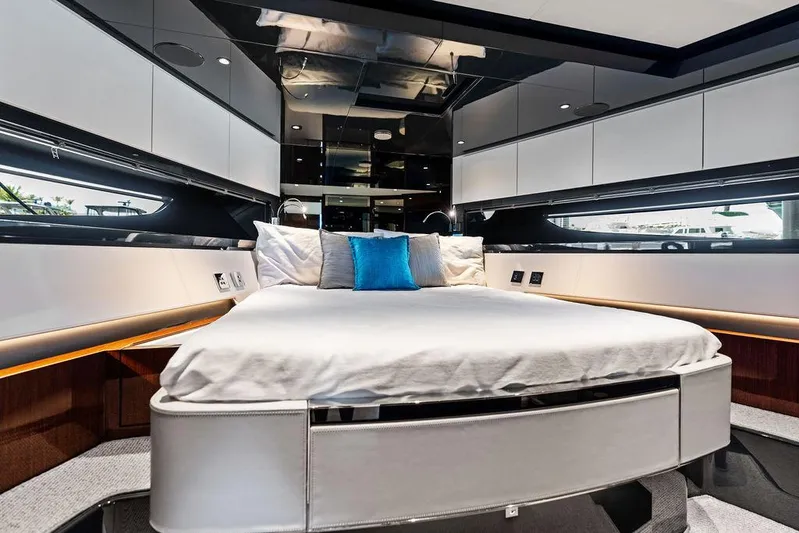 Club T Yacht Photos Pics Luxurious bedroom interior of 2023 Riva 68 Diable yacht with modern design and elegant furnishings.