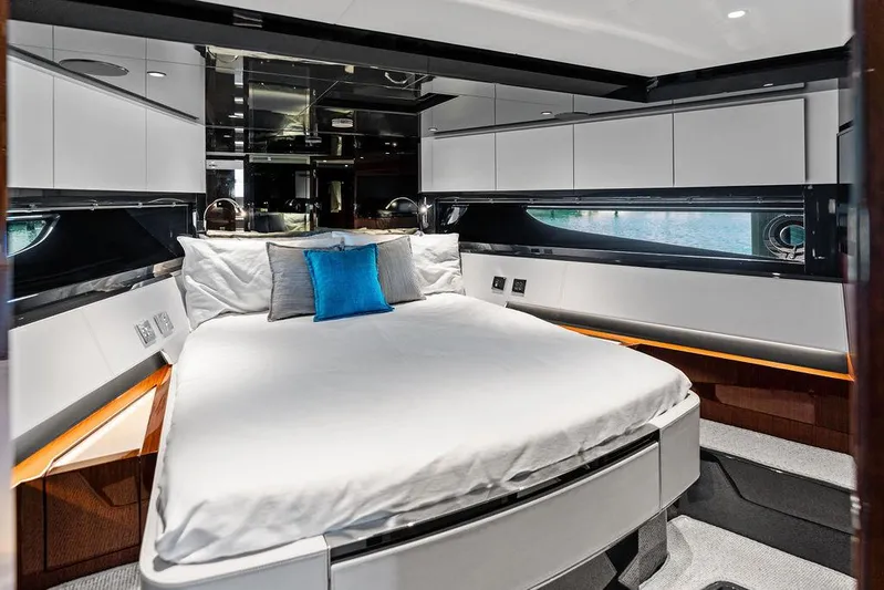 Club T Yacht Photos Pics Luxurious bedroom interior of 2023 Riva 68 Diable yacht with modern design and elegant furnishings.