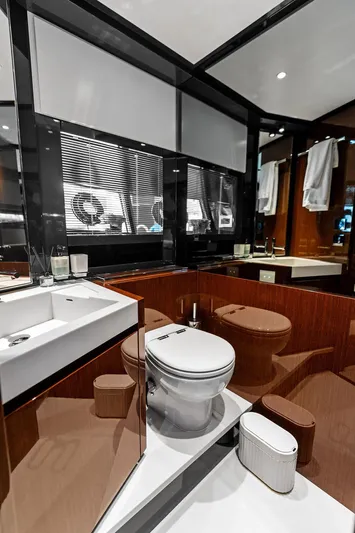 Club T Yacht Photos Pics Luxurious bathroom in 2023 Riva 68 Diable yacht with modern fixtures and elegant design.
