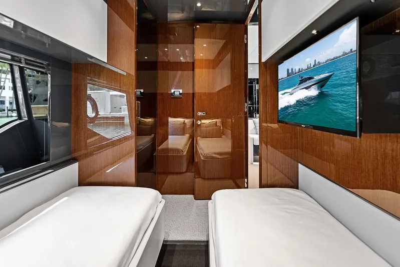 Club T Yacht Photos Pics Luxurious interior of 2023 Riva 68 Diable yacht with twin beds and modern decor.