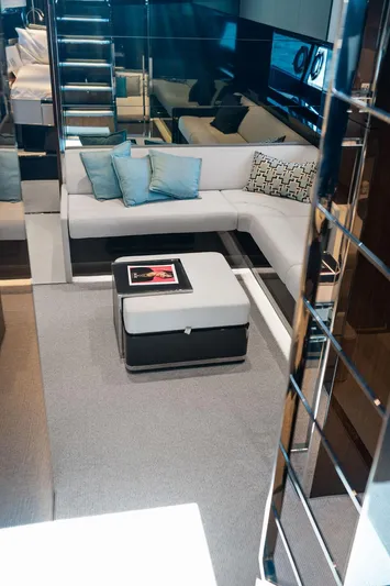 Club T Yacht Photos Pics Luxurious interior of 2023 Riva 68 Diable yacht with modern seating and decor.