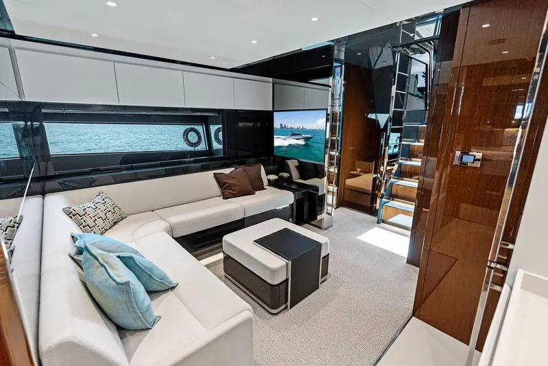 Club T Yacht Photos Pics Luxurious interior of 2023 Riva 68 Diable yacht with modern seating and elegant decor.