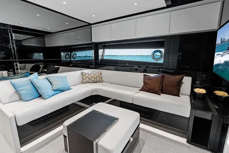 Club T Yacht Photos Pics Luxurious interior of 2023 Riva 68 Diable yacht with modern seating and ocean view.