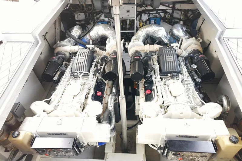  Yacht Photos Pics Engine room of a 1998 Otam 55 Millenium yacht, featuring dual Caterpillar engines.