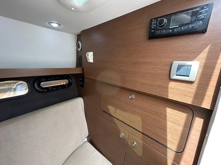 Yacht Photos Pics 2017 Sea Ray SLX 350 Outboard cabin interior with wood paneling and modern controls.