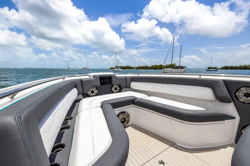  Yacht Photos Pics Luxurious seating on 2022 Cigarette 42 Auroris boat, with ocean view and blue skies.