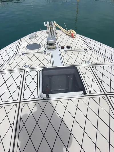  Yacht Photos Pics Bow of 1998 Otam 55 Millenium yacht with diamond-patterned deck.