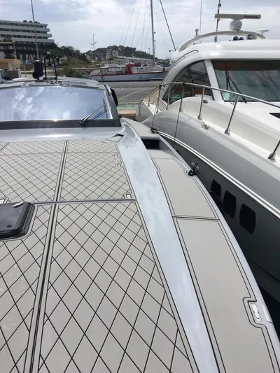  Yacht Photos Pics Otam 55 Millenium 1998 yacht docked beside another boat in a marina.