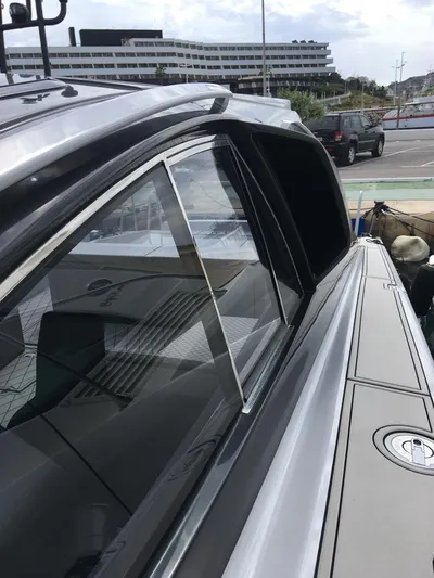  Yacht Photos Pics Otam 55 Millenium 1998 yacht with sleek design and modern features docked at marina.