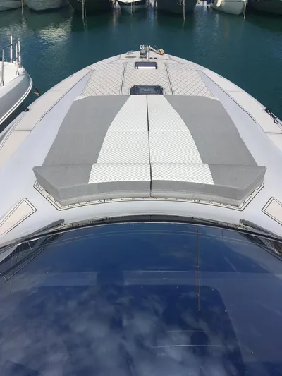  Yacht Photos Pics 1998 Otam 55 Millenium yacht with cushioned deck, docked in marina.