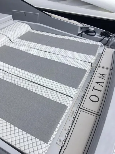  Yacht Photos Pics Otam 55 Millenium 1998 yacht with sleek gray and white cushioned deck.