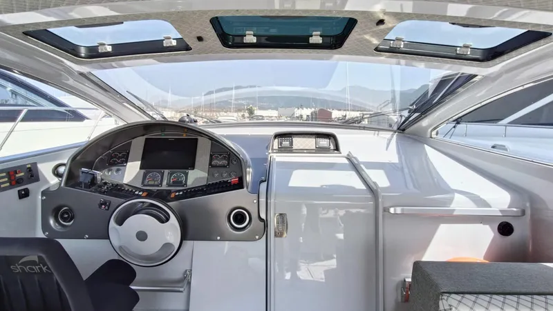  Yacht Photos Pics Interior cockpit of 1998 Otam 55 Millenium yacht with modern controls and panoramic windows.