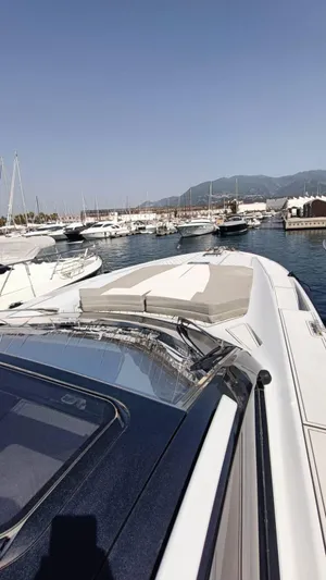  Yacht Photos Pics Otam 55 Millenium yacht docked in a marina, clear sky, 1998 model.