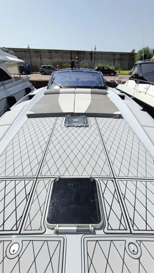  Yacht Photos Pics Otam 55 Millenium 1998 yacht with sleek deck design, docked under clear skies.