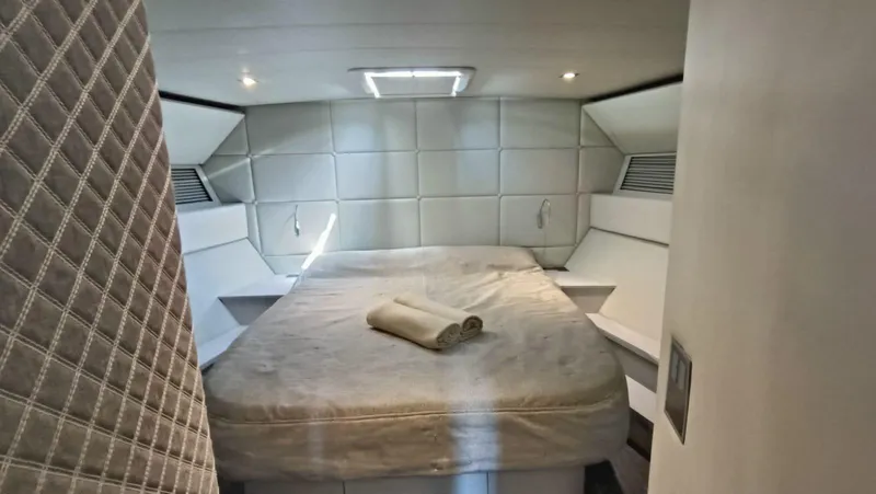  Yacht Photos Pics Luxurious cabin interior of 1998 Otam 55 Millenium yacht with bed and modern design.