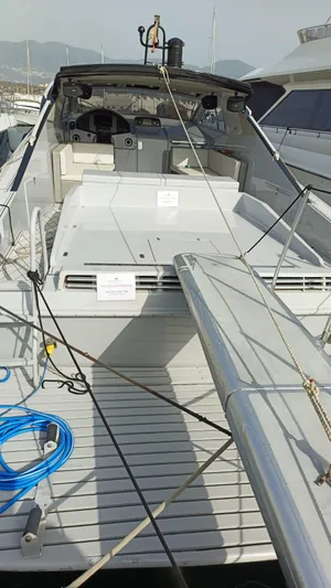  Yacht Photos Pics Otam 55 Millenium 1998 yacht docked, showcasing sleek design and spacious deck.