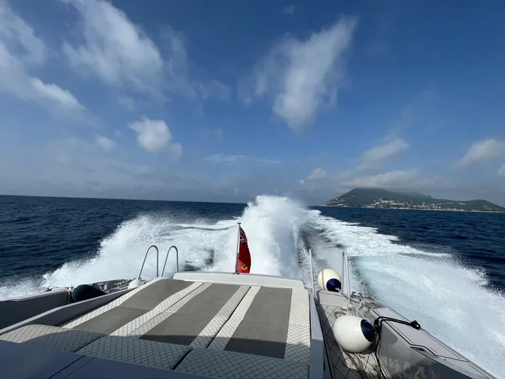  Yacht Photos Pics Otam 55 Millenium yacht cruising on open sea, leaving a wake behind.