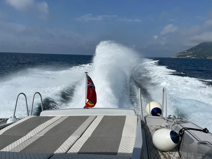  Yacht Photos Pics Otam 55 Millenium yacht cruising on open sea, leaving a wake behind.