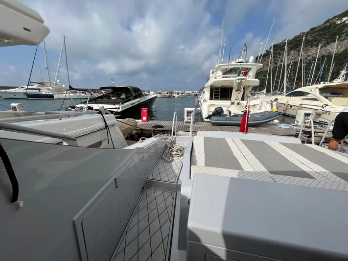  Yacht Photos Pics Docked Otam 55 Millenium yacht, 1998 model, in a marina with other boats.