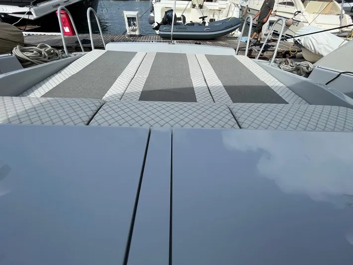  Yacht Photos Pics Otam 55 Millenium 1998 yacht deck with cushioned seating and marina view.