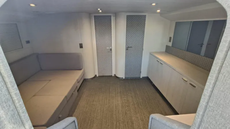  Yacht Photos Pics Interior of a 1998 Otam 55 Millenium yacht with modern furnishings and neutral tones.